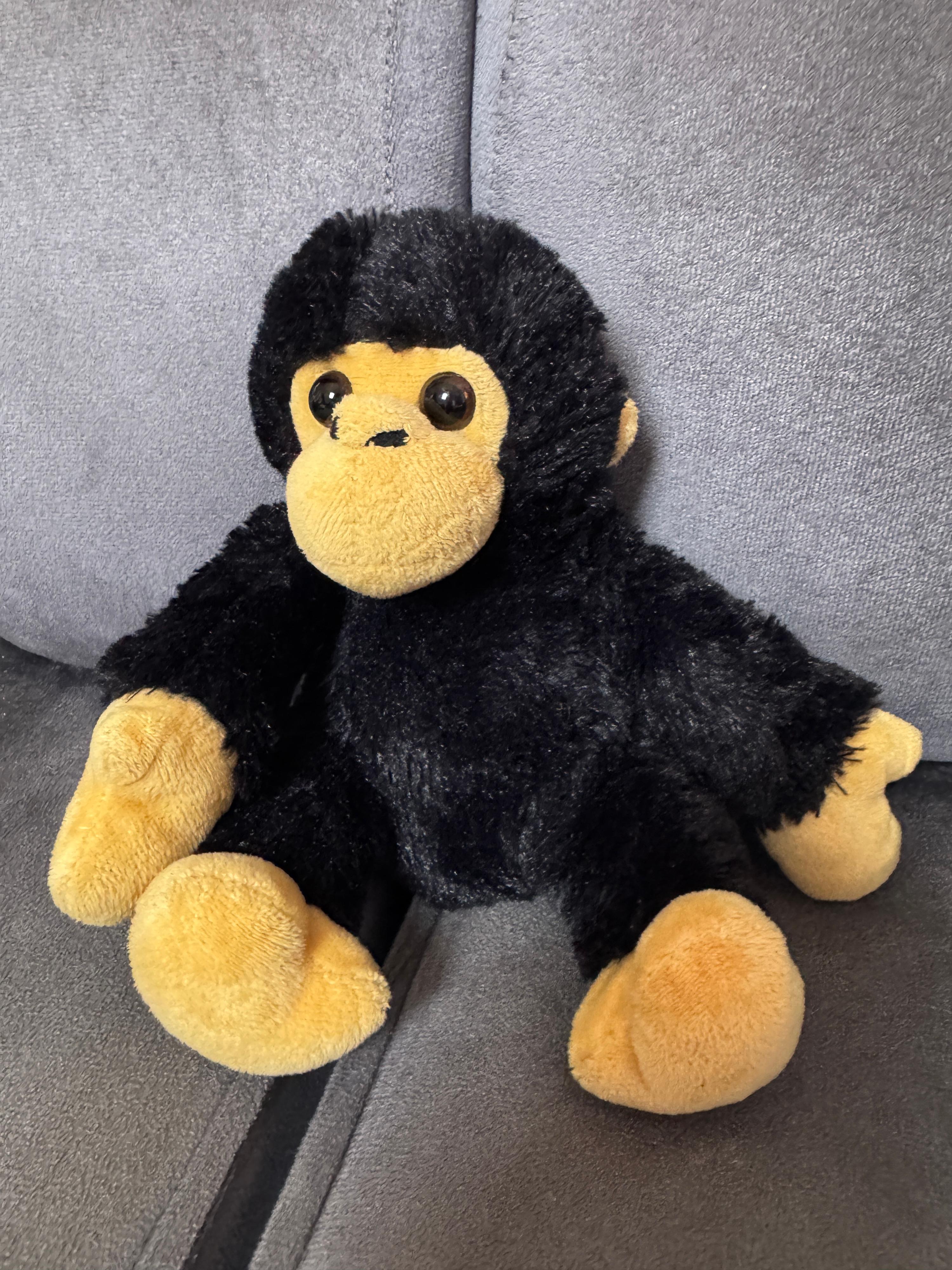 Adorable peluche singe noir et jaune